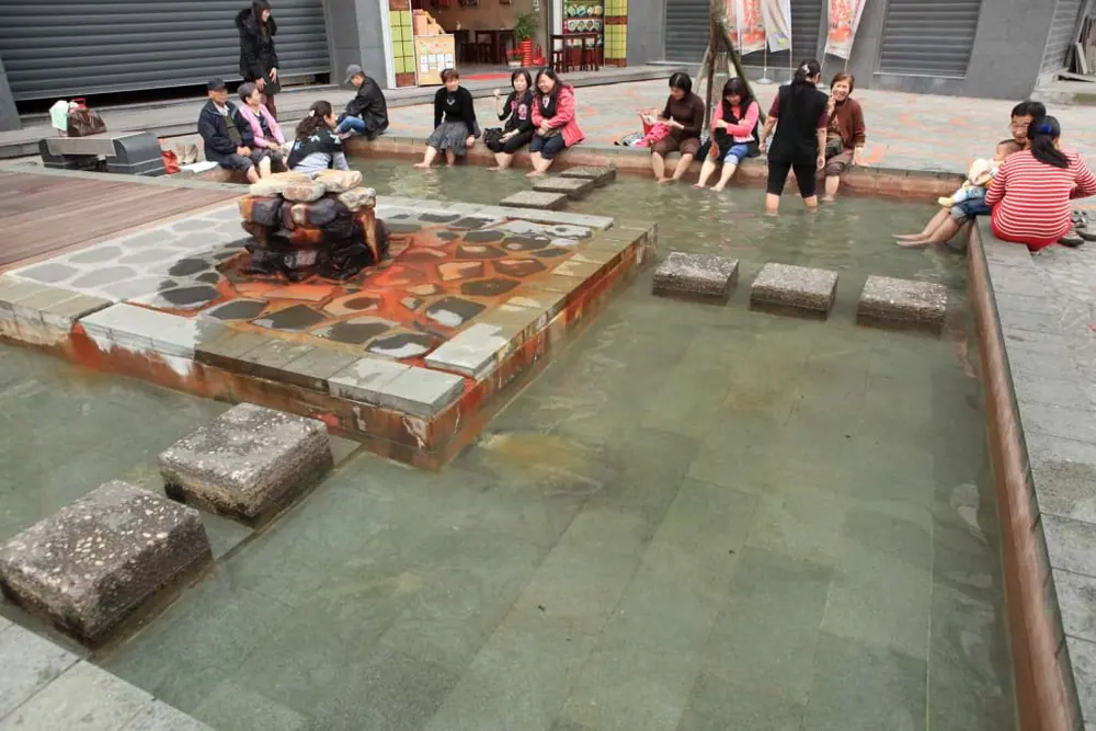 Public foot bath pools at Tangweigou Hot Spring Park in Jiaoxi