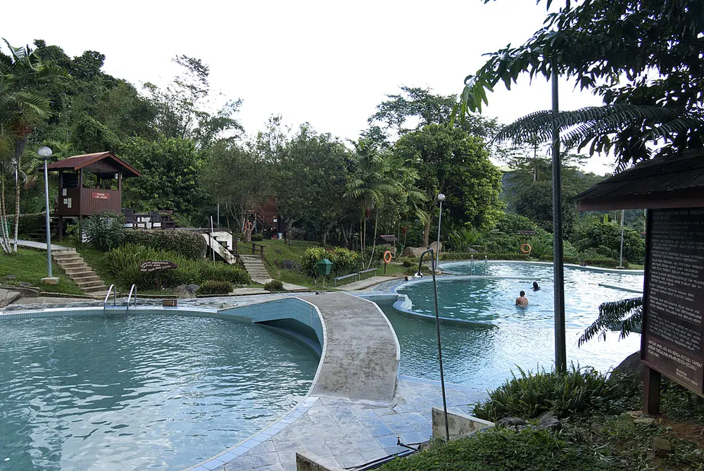 Open-air bathing tubs in rainforest at Poring Hot Springs, Sabah