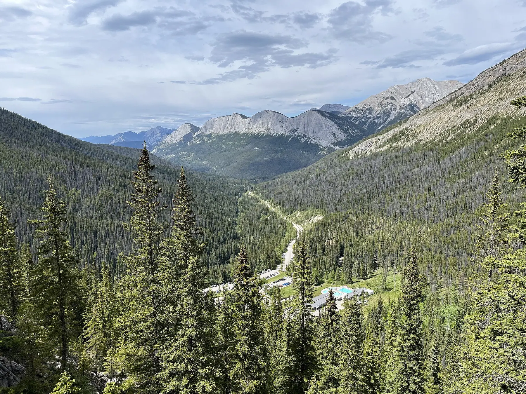 The open-air soaking pools at Miette Hot Springs below the ridges of the Fiddle Valley