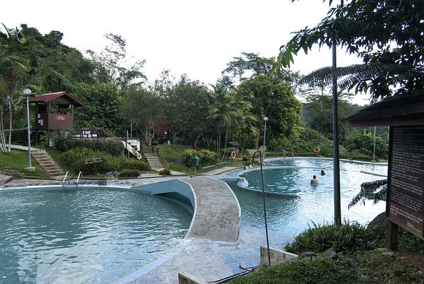 Open-air bathing tubs in rainforest at Poring Hot Springs, Sabah