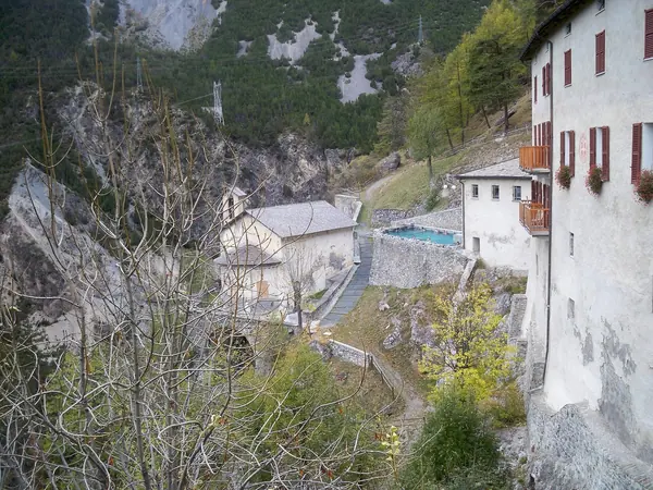 Historic bath buildings of the Bagni Vecchi on the mountainside above Bormio