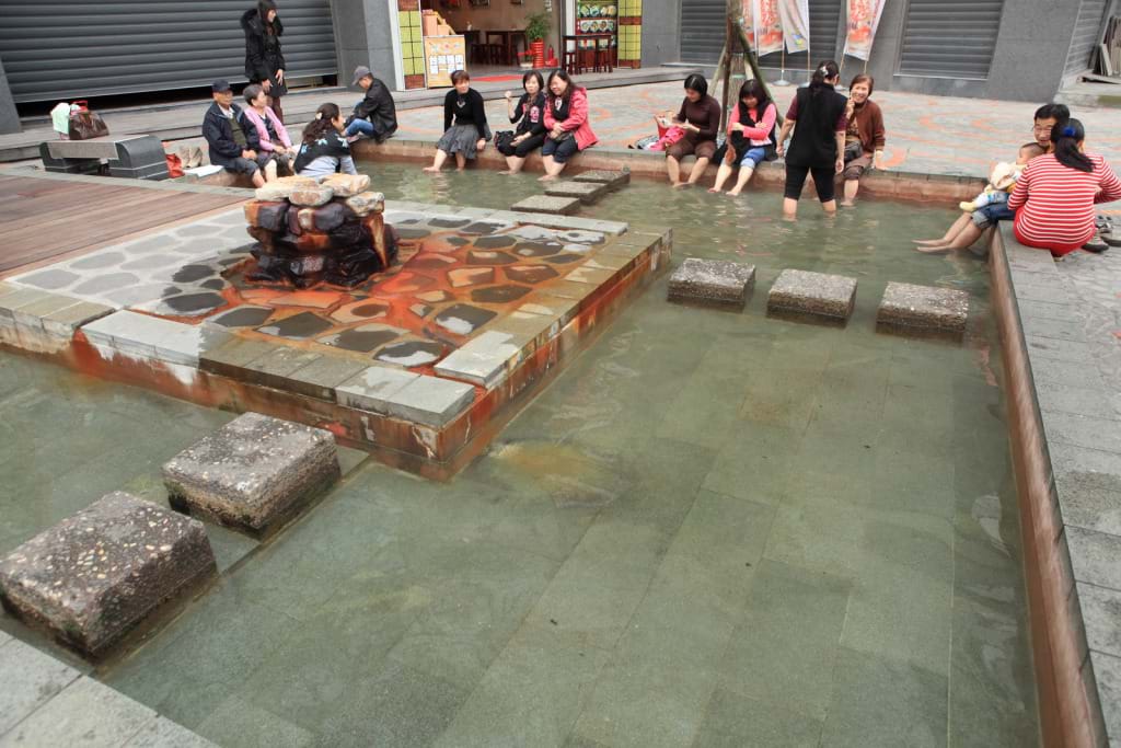 Public foot bath pools at Tangweigou Hot Spring Park in Jiaoxi