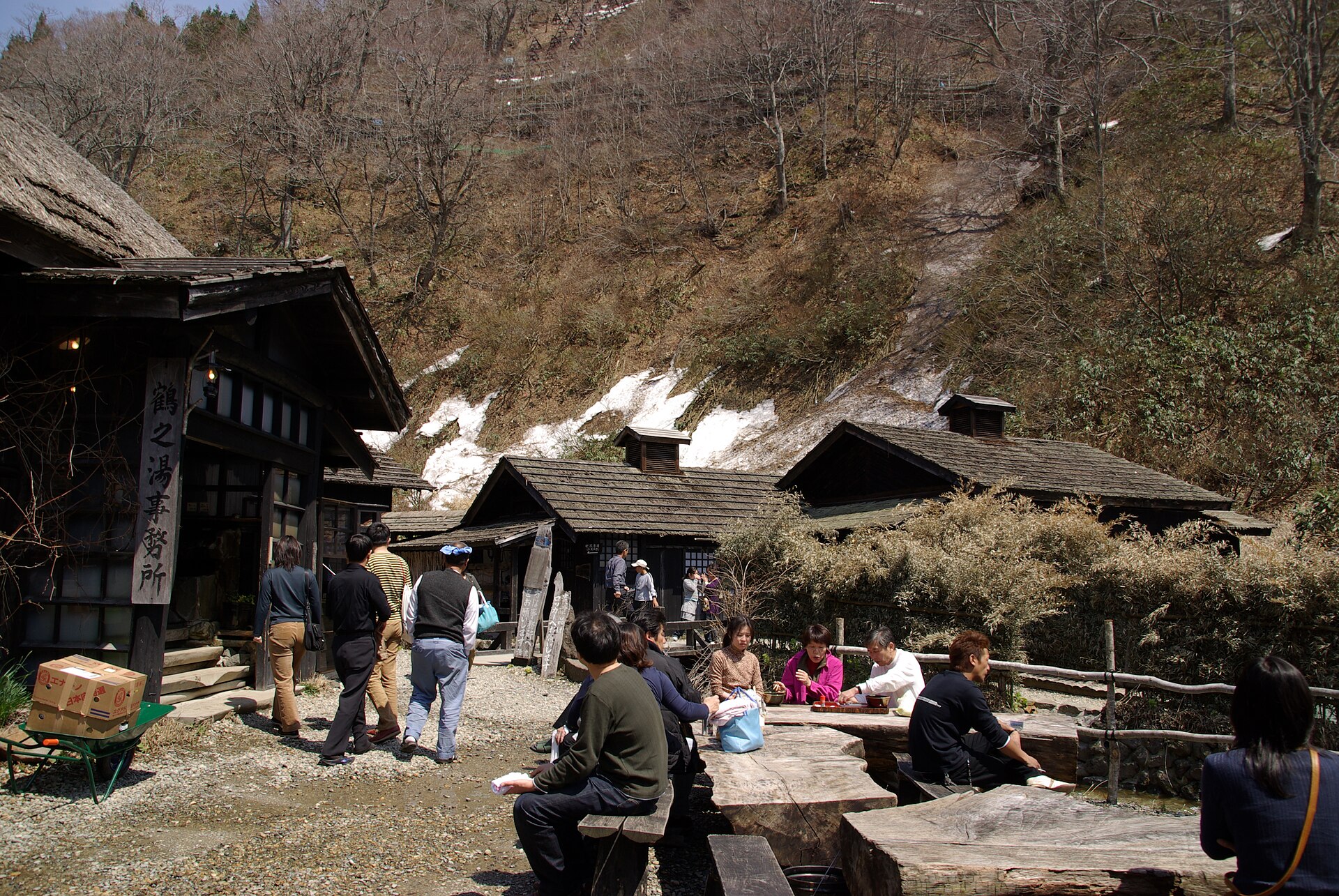Thatched wooden buildings of Tsurunoyu Onsen in the Akita mountains