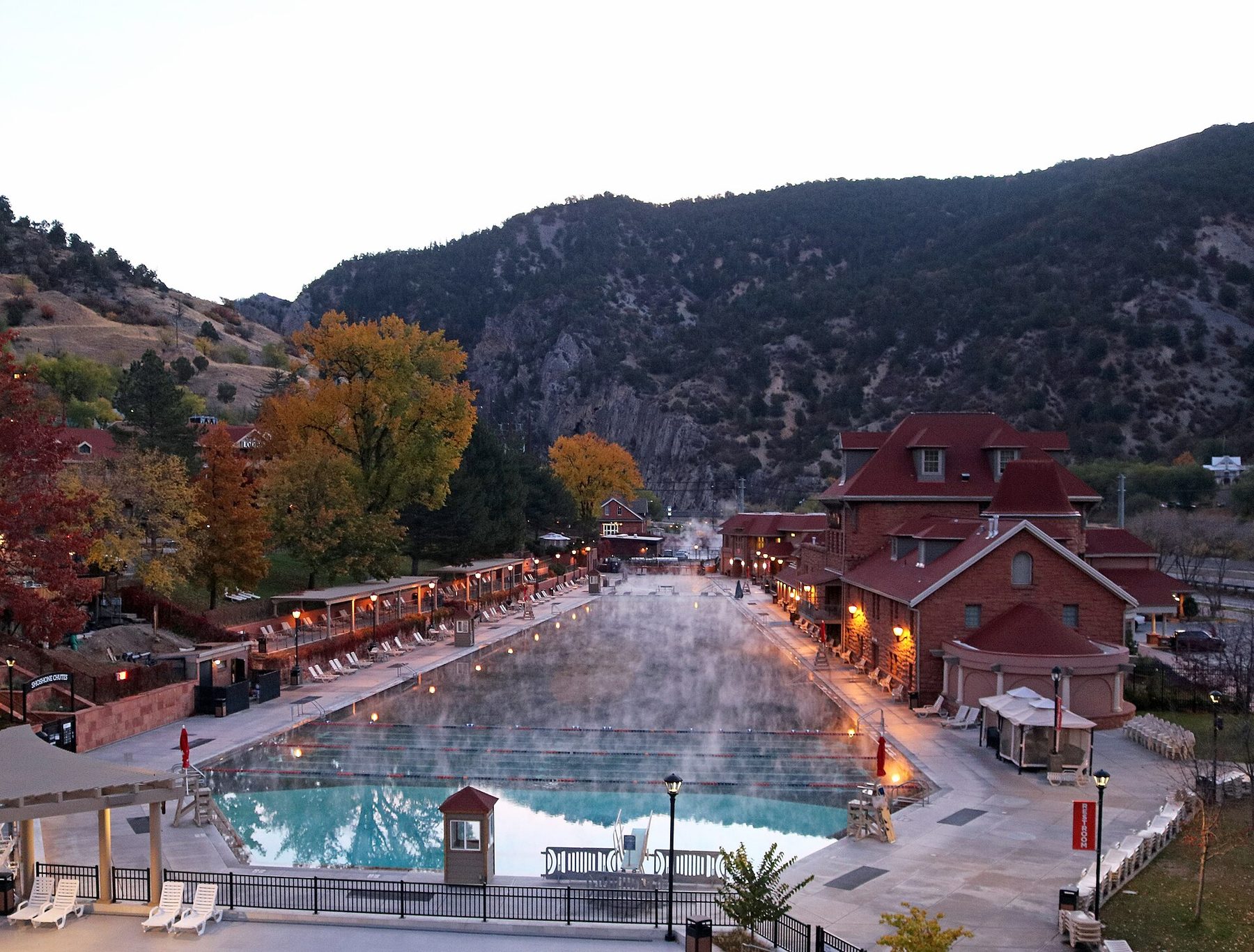 Steam rising from the long mineral pool at Glenwood Hot Springs at dusk