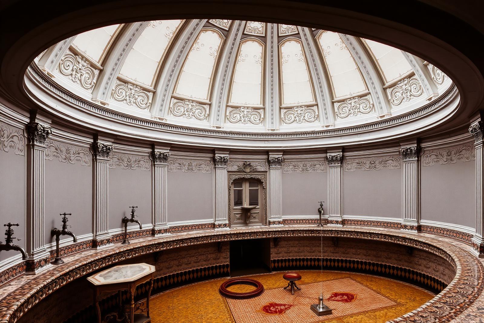 Ornate domed pump room with mineral water taps in Vichy